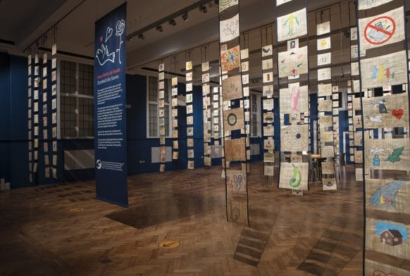 Dramatic installation of painted papyrus scrolls tells Londoners’ life stories